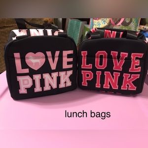 Two VS Pink lunchboxes.